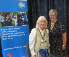 Our new President for Rotary year 2025/26 Terry Mahidrakar receives the Chain of Office from outgoing President Marcia Bryant
